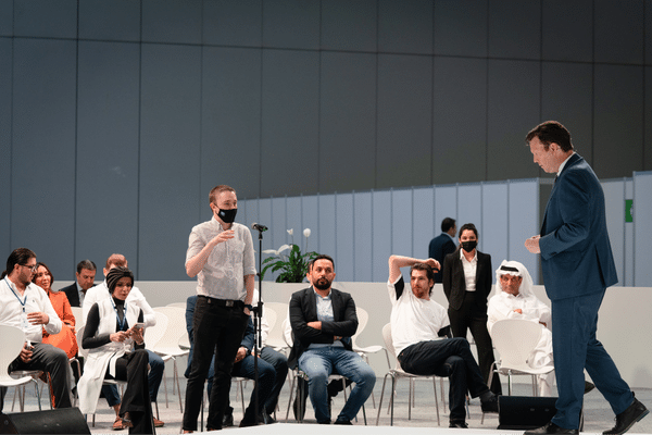 Attendees sitting at a talk